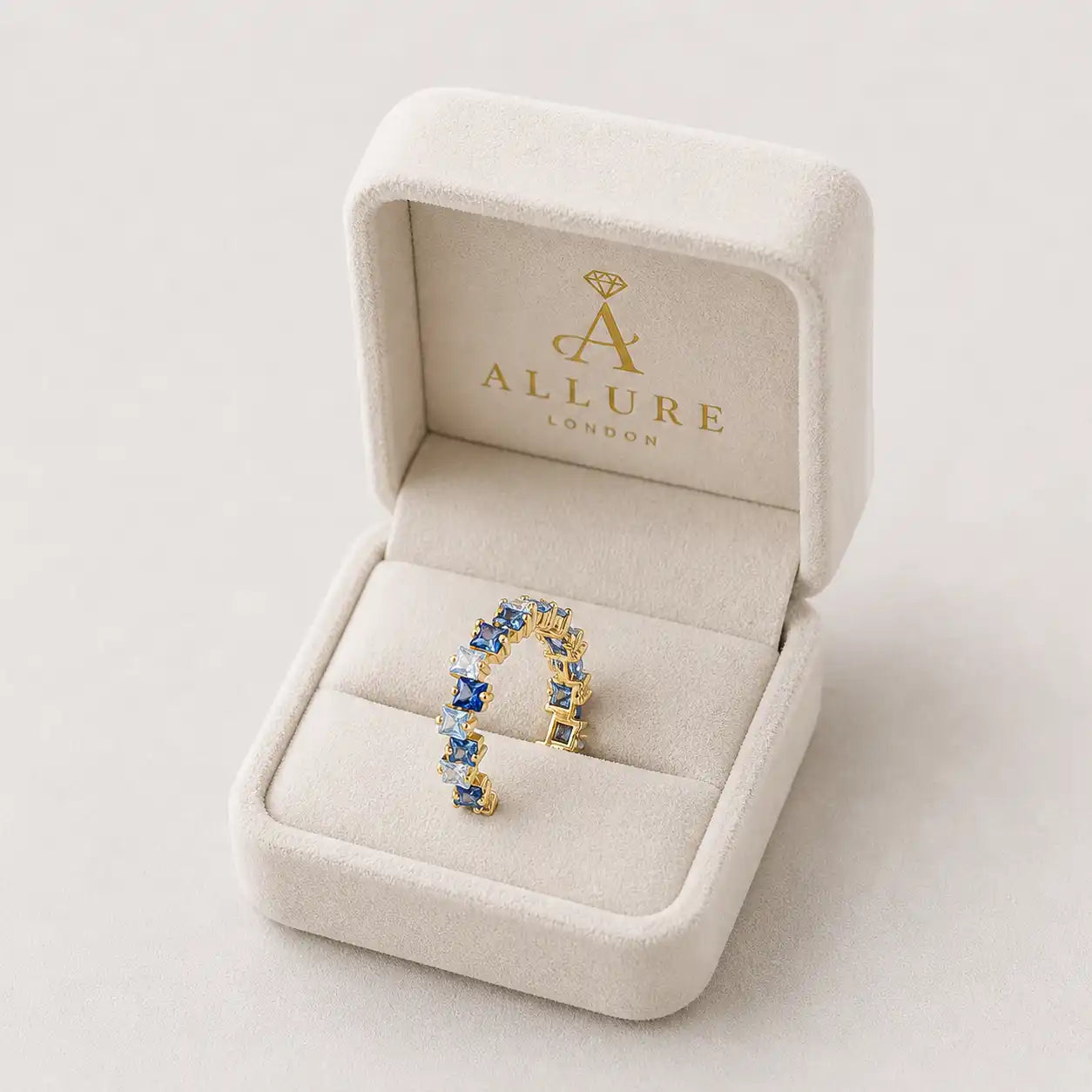 blue crystal eternity ring gold plated square stones